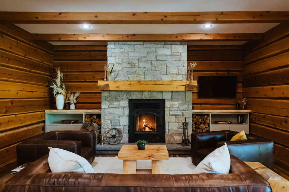 Relax in the main living room in front of the wood burning fire. 