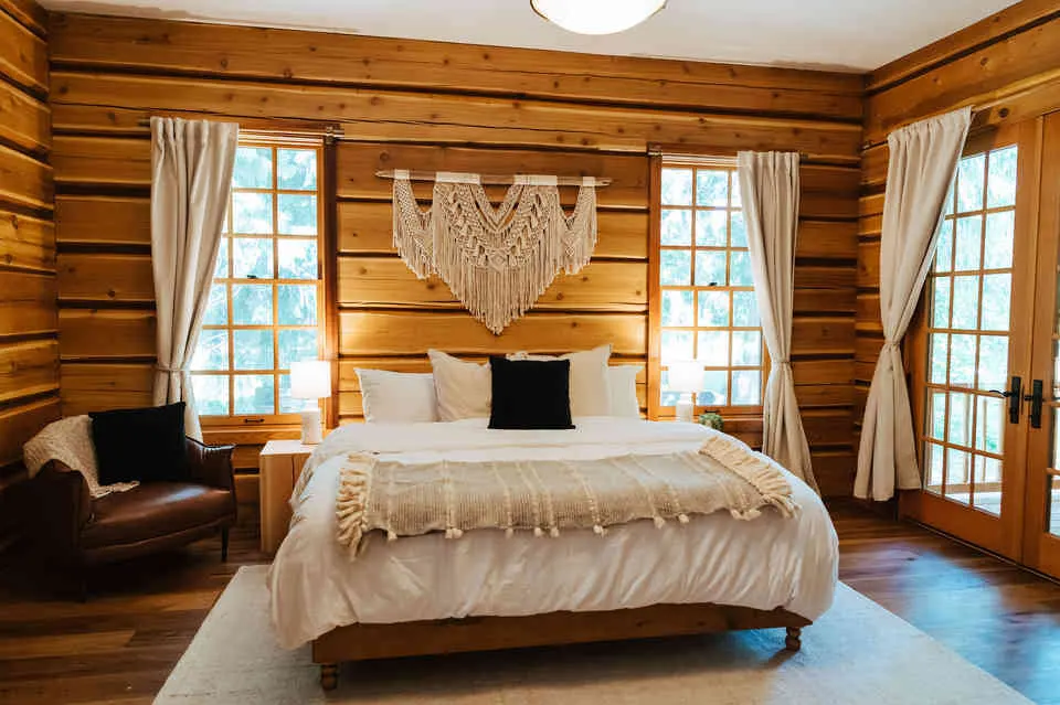 The primary bedroom is on the main floor with en-suite and direct access to the patio. 